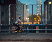 Men cycling on street