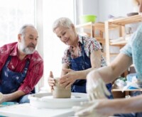 Couple making pottery