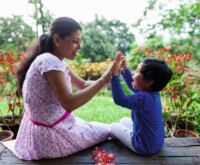 Woman playing with her child