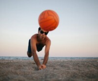 Man playing volleyball on the sea beach